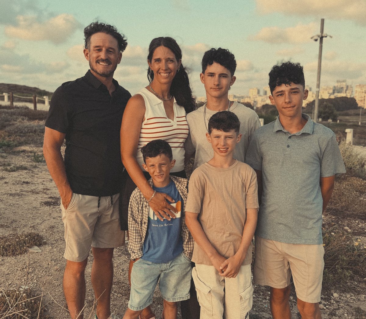 Nolan, Hannah and their four boys on the dunes above the Tel Aviv coast at sunset